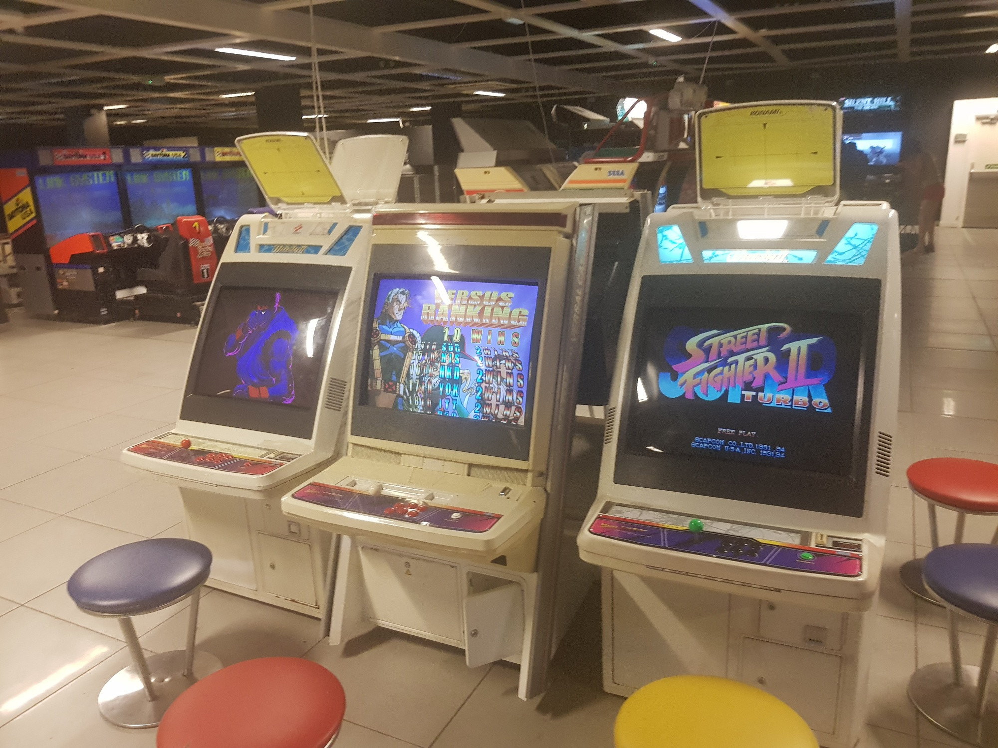 Some Super Street Fighter 2 Turbo and Marvel vs Capcom 2 head-to-head cabinets